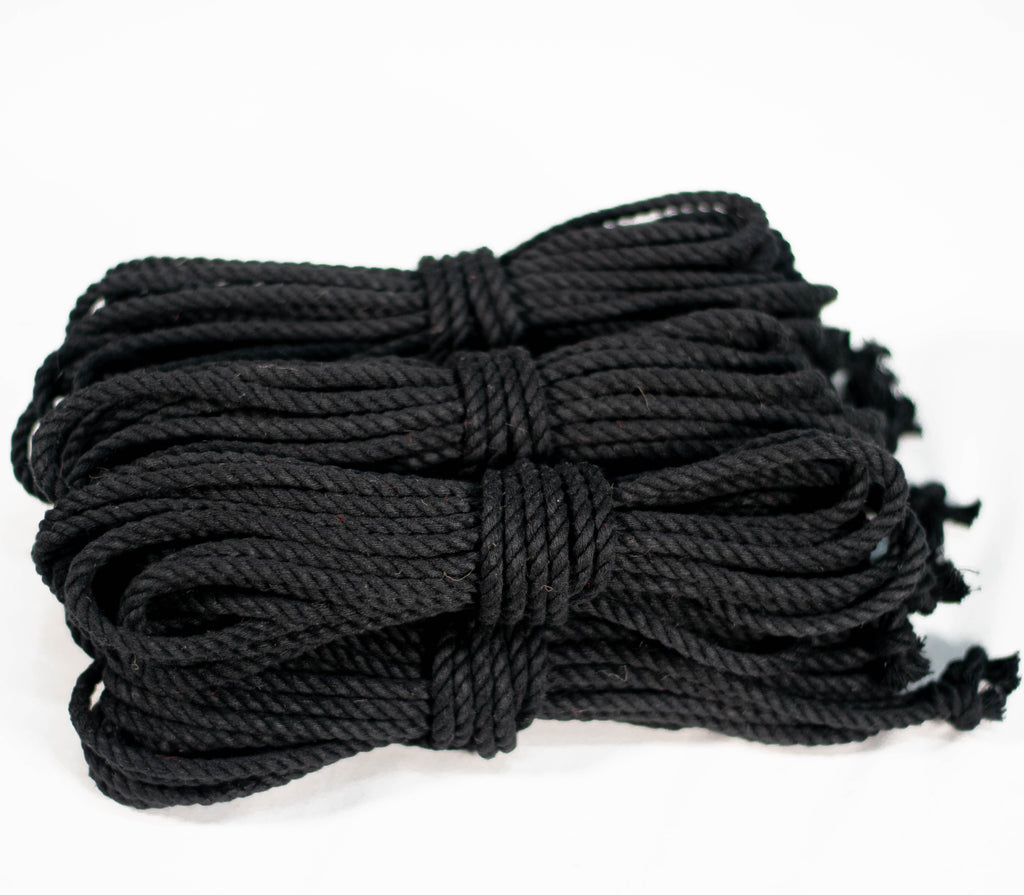 6 coiled black cotton ropes with knots on the end, displayed on a white background.